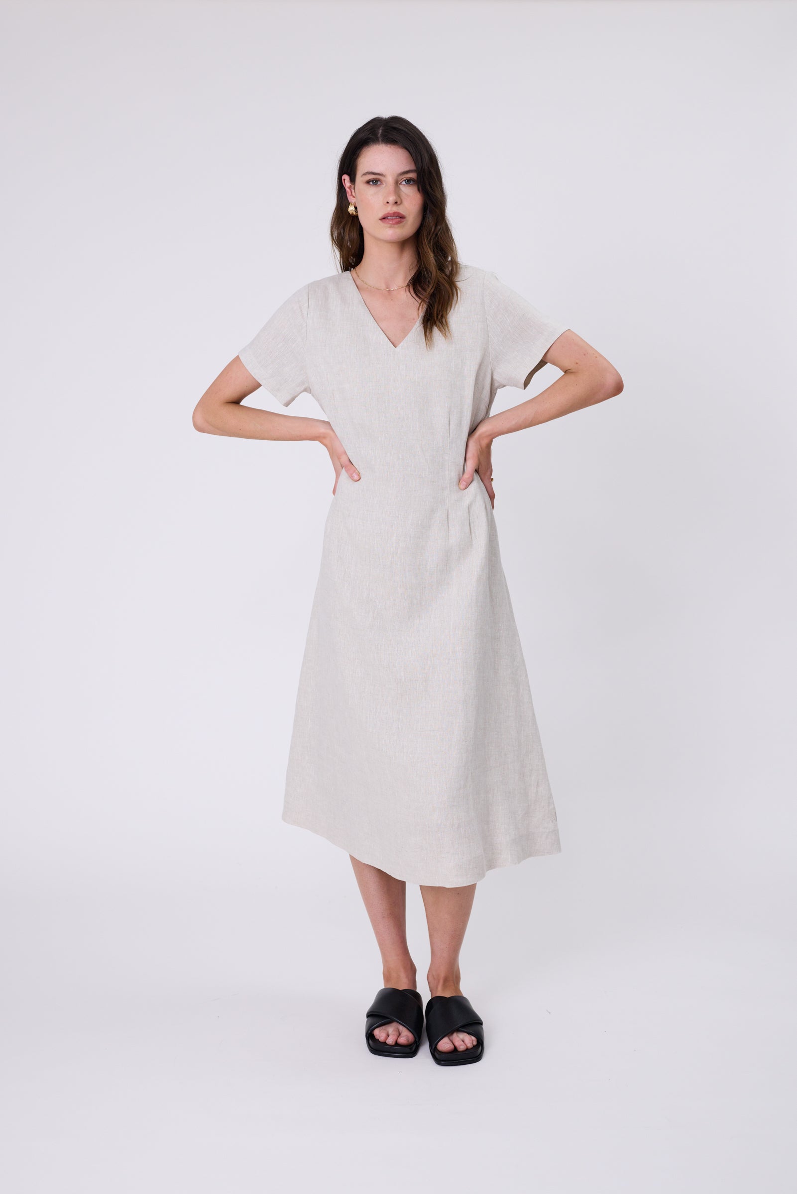 Seville Linen Dress in Natural — European linen midi with V-neckline, short sleeves, and adjustable waist ties.