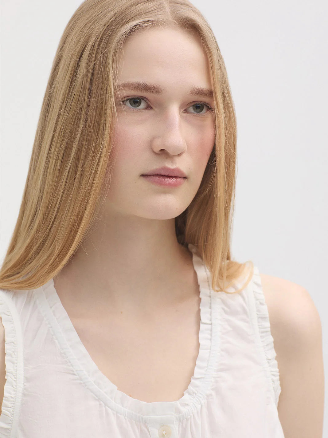 Ruffled White Sleeveless Shirt