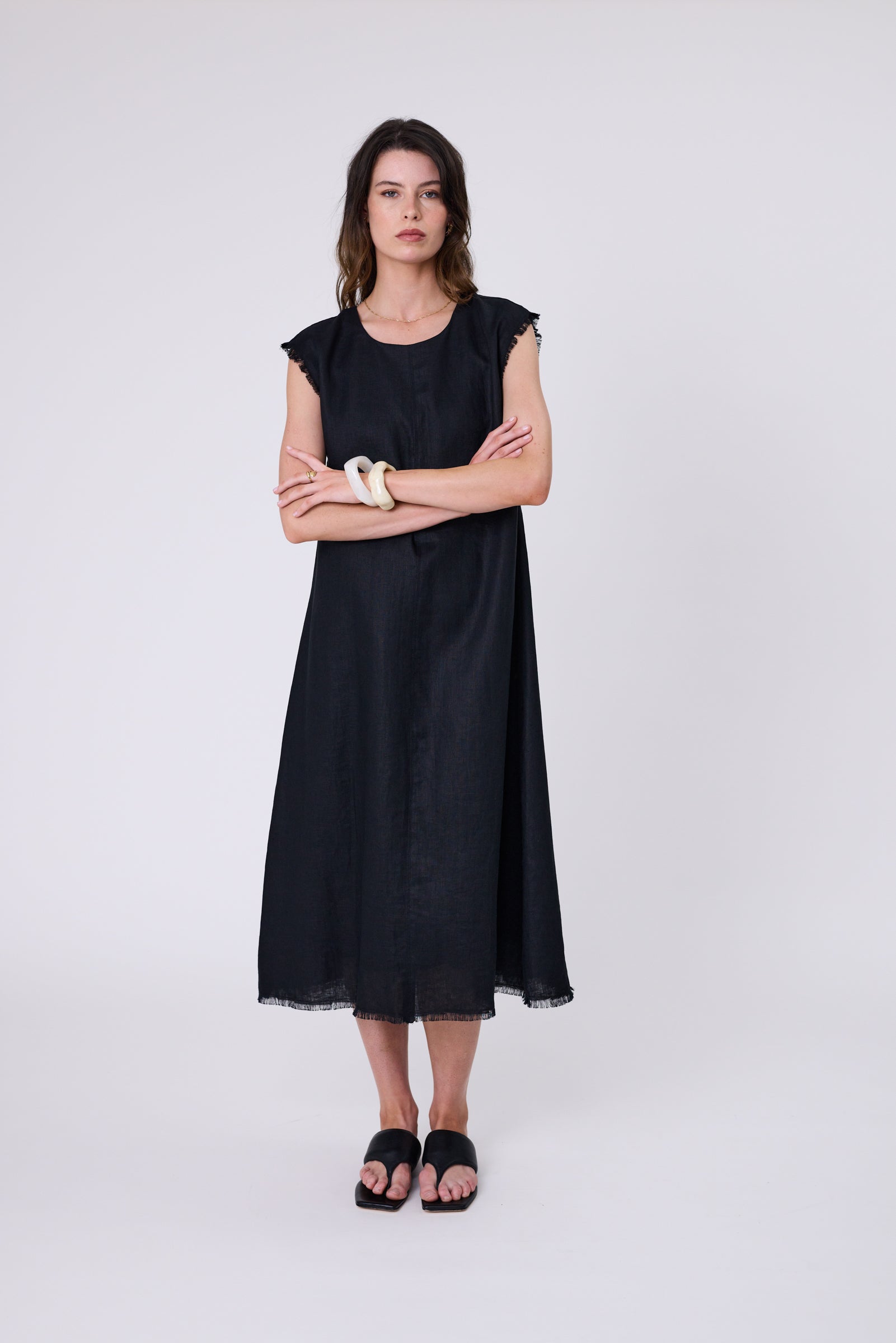 Costa Linen Dress in Black — European linen A-line dress with frayed cap sleeves, keyhole back, and centre seam detail.