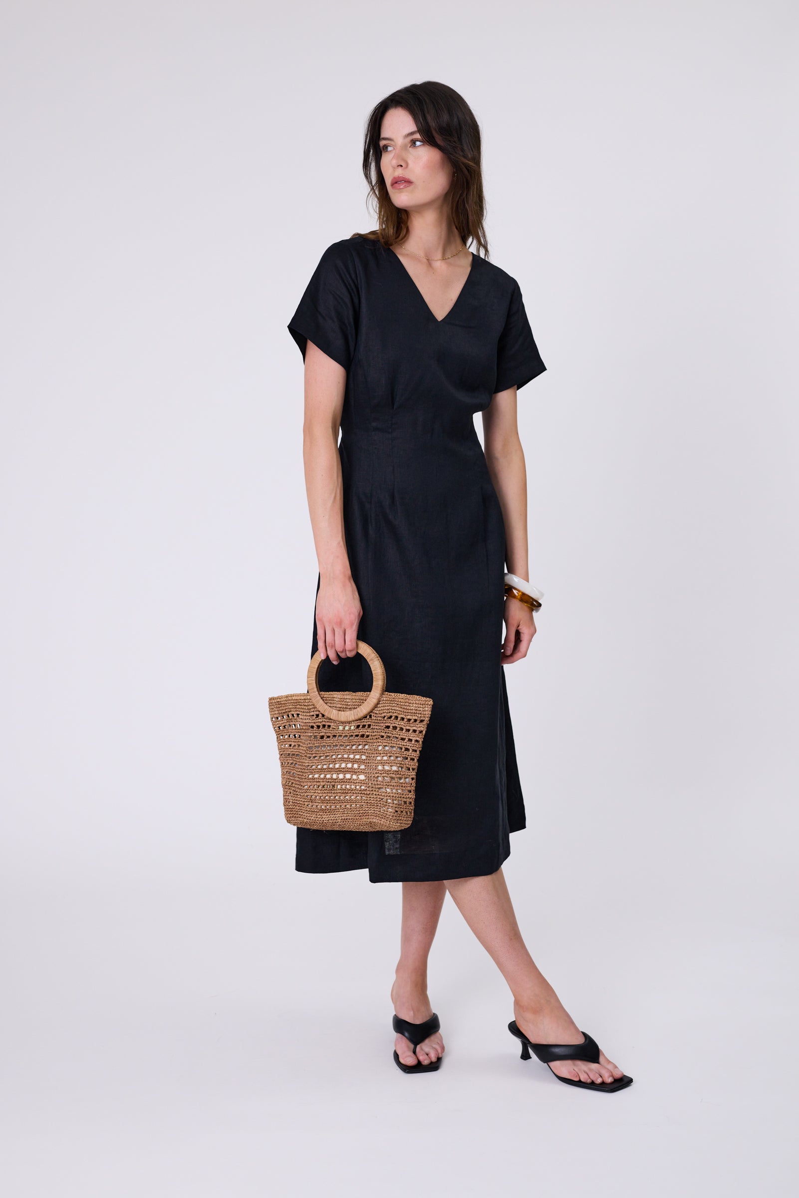 Seville Linen Dress in Black — European linen midi with V-neckline, short sleeves, and adjustable waist ties.